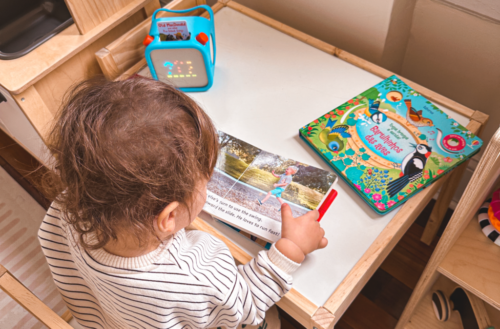 My son reading books and listening to his Yoto Player.