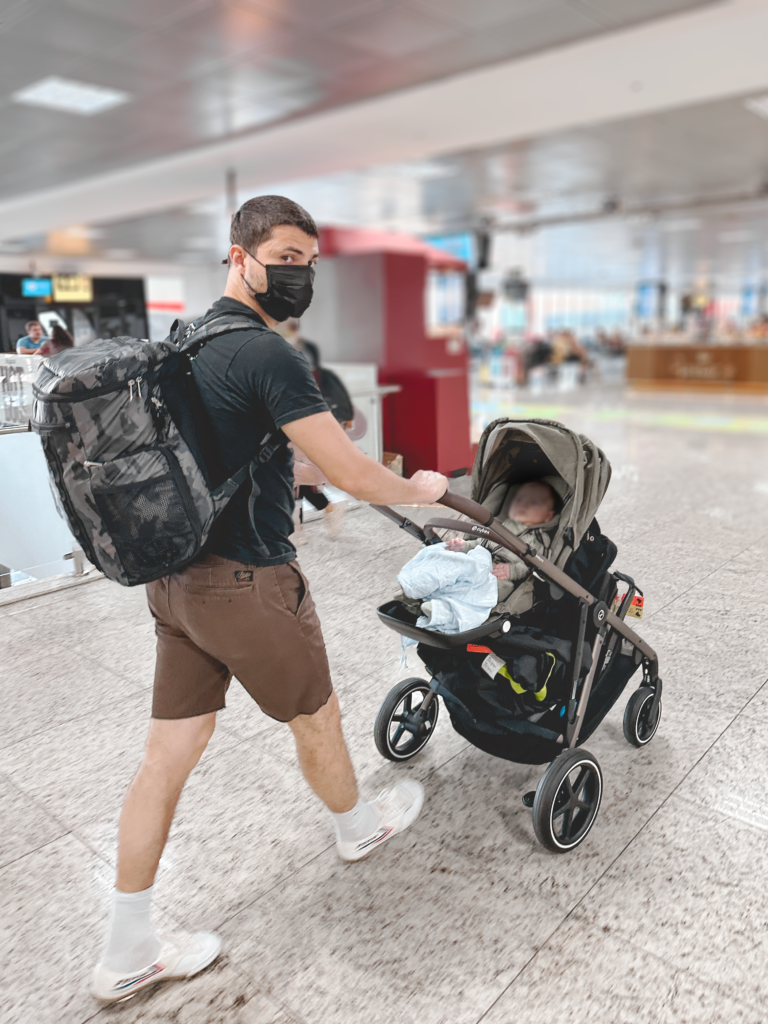 We prefer using a stroller for moving around the airport with our baby